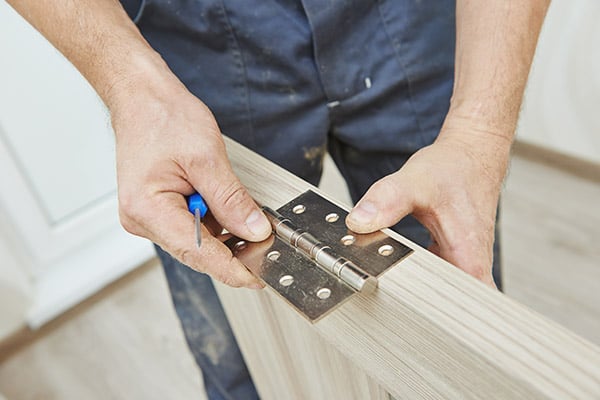 door-hinge-getting-installed-on-a-door.jpg