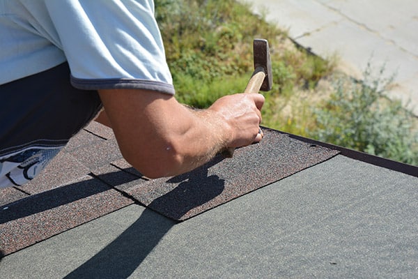 roofing-profesionals-installing-shingles.jpeg