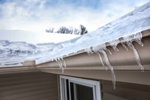 bigstock-Ice-dam-in-gutter-and-ice-froz-403932143.jpg