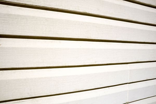 bigstock-Yellow-Vinyl-Siding-Perspectiv-359857630.jpg