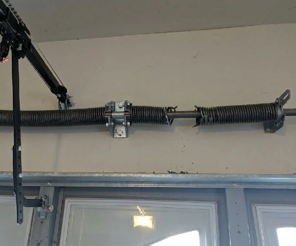 broken torsion spring above a garage door