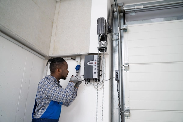 Unplugging a garage door opener before adjusting the sensors